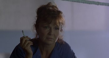 Movie still from “Billy Elliot” (2000), directed by Stephen Daldry – A person holding a cigarette; Close Up shot, Low angle