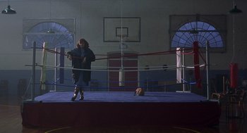 Movie still from “Billy Elliot” (2000), directed by Stephen Daldry – A person standing in the middle of a boxing ring; Wide shot, Low angle