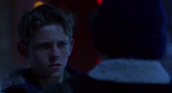 Movie still from “Billy Elliot” (2000), directed by Stephen Daldry – A young man looking at another person in a dark room; Close Up shot, Over the shoulder angle