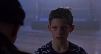 Movie still from “Billy Elliot” (2000), directed by Stephen Daldry – A young boy is staring at the camera; Close Up shot, Over the shoulder angle