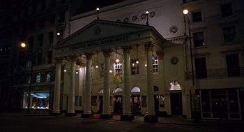 Movie still from “Billy Elliot” (2000), directed by Stephen Daldry – A large building that has pillars on the front of it; Extreme Wide shot, Low angle