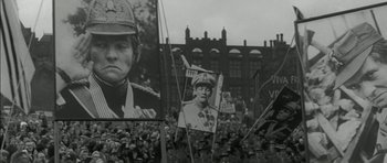 Movie still from “Billy Liar” (1963), directed by John Schlesinger – A black and white photo of a crowd of people; Close Up shot, Low angle