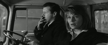 Movie still from “Billy Liar” (1963), directed by John Schlesinger – A man and a woman sitting next to each other; Close Up shot, Low angle