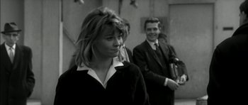 Movie still from “Billy Liar” (1963), directed by John Schlesinger – A black and white photo of a woman and a man; Medium shot, Over the shoulder angle