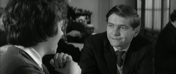 Movie still from “Billy Liar” (1963), directed by John Schlesinger – A man and a woman sitting at a table; Close Up shot, Over the shoulder angle