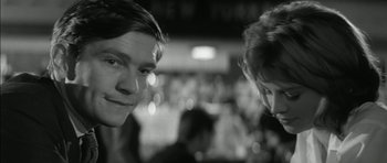Movie still from “Billy Liar” (1963), directed by John Schlesinger – Two people standing next to each other in a room; Close Up shot, Over the shoulder angle