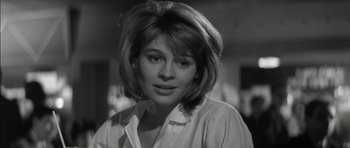 Movie still from “Billy Liar” (1963), directed by John Schlesinger – A black - and - white photo of a woman in a white shirt; Close Up shot, Low angle