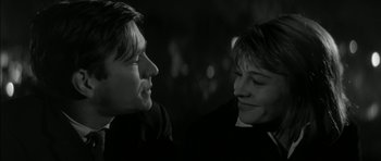 Movie still from “Billy Liar” (1963), directed by John Schlesinger – A man and a woman looking at one another; Close Up shot, Over the shoulder angle
