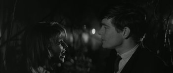 Movie still from “Billy Liar” (1963), directed by John Schlesinger – A man and a woman talking to each other; Close Up shot, Over the shoulder angle