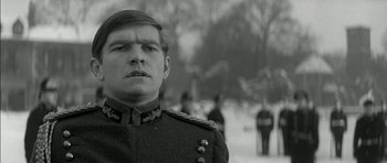 Movie still from “Billy Liar” (1963), directed by John Schlesinger – A black and white photo of a man in a military uniform; Close Up shot, Low angle