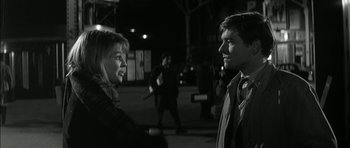 Movie still from “Billy Liar” (1963), directed by John Schlesinger – A man and a woman talking to each other in the dark; Close Up shot, Over the shoulder angle