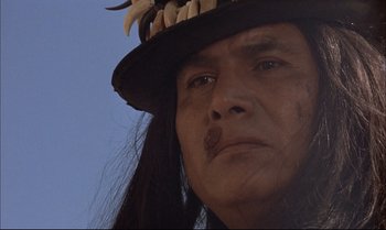 Movie still from “Billy Two Hats” (1974), directed by Ted Kotcheff – A person wearing a hat; Close Up shot, Low angle