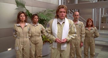 Movie still from “Bio-Dome” (1996), directed by Jason Bloom – A group of people standing next to each other; Medium shot, Low angle