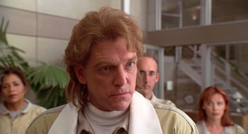 Movie still from “Bio-Dome” (1996), directed by Jason Bloom – A person wearing a shirt; Close Up shot, Low angle