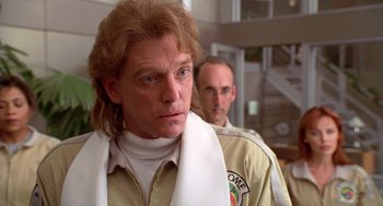 Movie still from “Bio-Dome” (1996), directed by Jason Bloom – A man with a white towel around his neck and another man with a white towel around his neck; Close Up shot, Over the shoulder angle