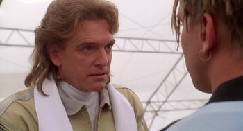 Movie still from “Bio-Dome” (1996), directed by Jason Bloom – A person wearing a jacket; Close Up shot, Over the shoulder angle