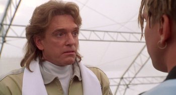 Movie still from “Bio-Dome” (1996), directed by Jason Bloom – A person with long hair; Close Up shot, Low angle