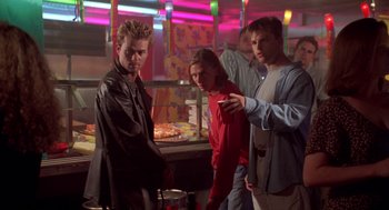 Movie still from “Bio-Dome” (1996), directed by Jason Bloom – A group of young men standing in a room; Medium shot, Low angle