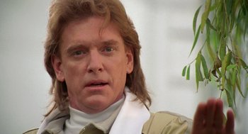 Movie still from “Bio-Dome” (1996), directed by Jason Bloom – A person with long red hair; Close Up shot, Low angle