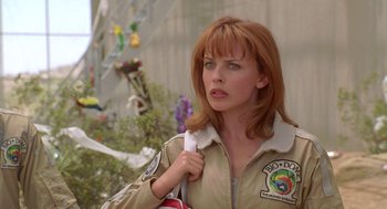 Movie still from “Bio-Dome” (1996), directed by Jason Bloom – A person holding a bag in her hand; Close Up shot, Low angle