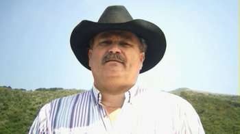 Movie still from “Birdemic: Shock and Terror” (2010), directed by James Nguyen – A person wearing a cowboy hat; Close Up shot, Low angle