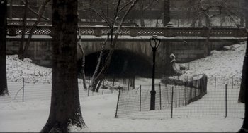 Movie still from “Birth” (2004), directed by Jonathan Glazer – A black and white photo of a bridge in the snow; Extreme Wide shot, High angle