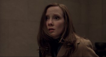Movie still from “Birth” (2004), directed by Jonathan Glazer – A woman with long brown hair looking to her left; Close Up shot, Low angle