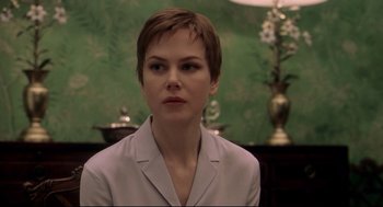 Movie still from “Birth” (2004), directed by Jonathan Glazer – A person with short hair; Close Up shot, Over the shoulder angle