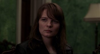 Movie still from “Birth” (2004), directed by Jonathan Glazer – A person with long hair; Close Up shot, Over the shoulder angle