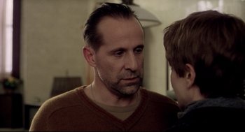 Movie still from “Birth” (2004), directed by Jonathan Glazer – A person wearing a sweater; Close Up shot, Over the shoulder angle