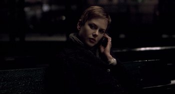 Movie still from “Birth” (2004), directed by Jonathan Glazer – A young man is talking on a cell phone; Close Up shot, Over the shoulder angle