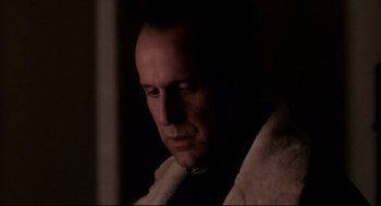 Movie still from “Birth” (2004), directed by Jonathan Glazer – A person wearing a jacket; Close Up shot, Low angle