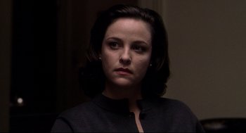 Movie still from “Birth” (2004), directed by Jonathan Glazer – A person with short hair; Close Up shot, Over the shoulder angle