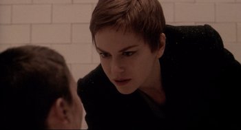 Movie still from “Birth” (2004), directed by Jonathan Glazer – A woman with short brown hair looking at another woman; Close Up shot, Over the shoulder angle