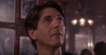 Movie still from “Bitter Moon” (1992), directed by Roman Polanski – A person looking up at something; Close Up shot, Low angle