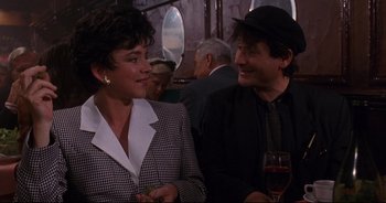 Movie still from “Bitter Moon” (1992), directed by Roman Polanski – A man and a woman are sitting next to each other; Medium shot, Over the shoulder angle