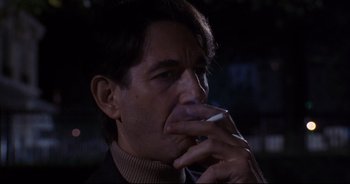 Movie still from “Bitter Moon” (1992), directed by Roman Polanski – A person holding a cigarette in his mouth; Close Up shot, Low angle