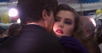 Movie still from “Bitter Moon” (1992), directed by Roman Polanski – A man and a woman embracing each other in front of a mirror; Close Up shot, Over the shoulder angle