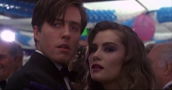 Movie still from “Bitter Moon” (1992), directed by Roman Polanski – A man and a woman posing for a picture; Close Up shot, Low angle