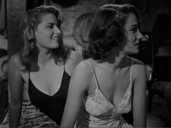 Movie still from “Bitter Rice” (1949), directed by Giuseppe De Santis – Two beautiful young women standing next to each other; Medium shot, High angle