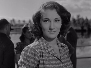 Movie still from “Bitter Rice” (1949), directed by Giuseppe De Santis – An old photo of an older woman in a striped shirt; Close Up shot, Low angle