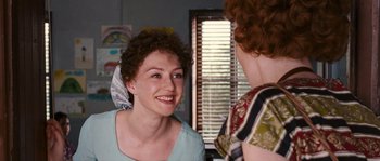 Movie still from “Black Book” (2006), directed by Paul Verhoeven – Two women talking to each other in front of a window; Close Up shot, Over the shoulder angle