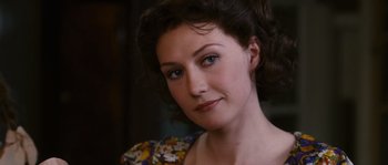 Movie still from “Black Book” (2006), directed by Paul Verhoeven – A person wearing a dress; Close Up shot, Over the shoulder angle