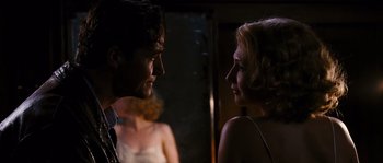 Movie still from “Black Book” (2006), directed by Paul Verhoeven – A man and a woman talking to each other; Close Up shot, Over the shoulder angle