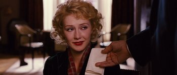 Movie still from “Black Book” (2006), directed by Paul Verhoeven – A woman is holding up a piece of paper; Close Up shot, Over the shoulder angle