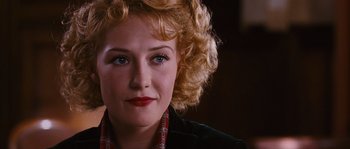 Movie still from “Black Book” (2006), directed by Paul Verhoeven – A person with blonde curly hair; Close Up shot, Over the shoulder angle
