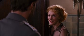 Movie still from “Black Book” (2006), directed by Paul Verhoeven – A man and a woman looking at one another in front of a mirror; Close Up shot, Over the shoulder angle