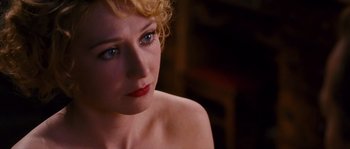 Movie still from “Black Book” (2006), directed by Paul Verhoeven – A person sitting down with her eyes closed; Close Up shot, Over the shoulder angle