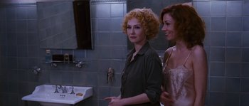 Movie still from “Black Book” (2006), directed by Paul Verhoeven – Two women standing in front of a bathroom sink; Medium shot, Over the shoulder angle
