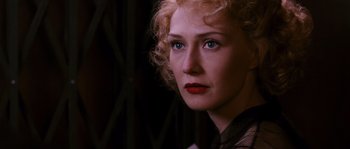 Movie still from “Black Book” (2006), directed by Paul Verhoeven – A person with curly blonde hair; Close Up shot, Over the shoulder angle